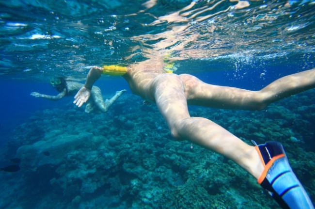 Photo of nudists which float bare under water